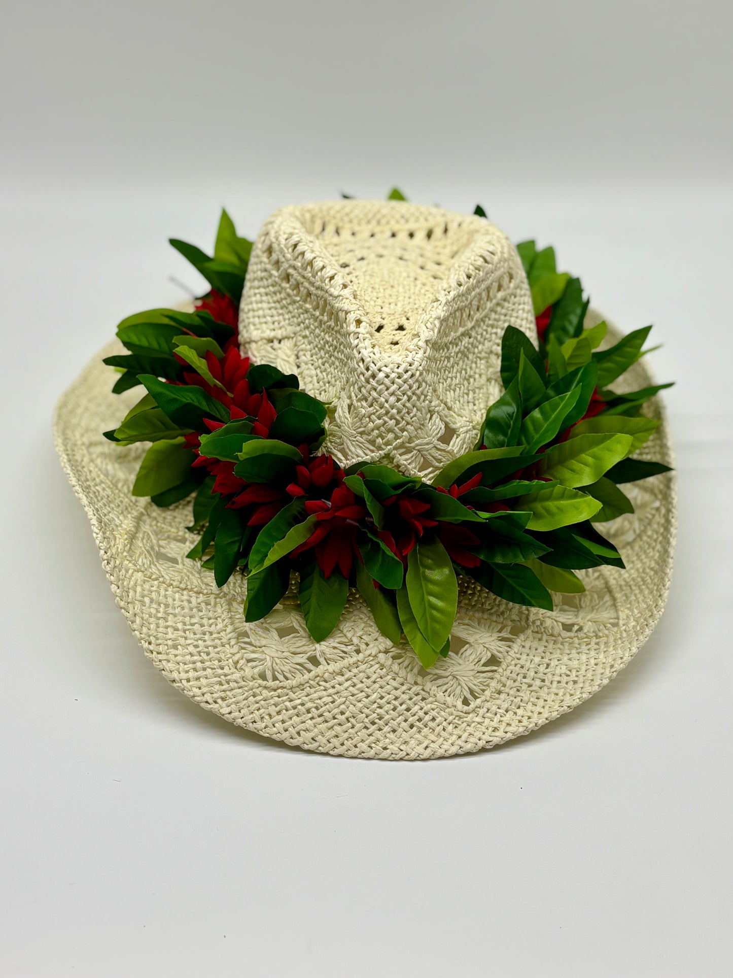 Maile Forever Lei Po‘o gracefully draped over a straw cowboy hat