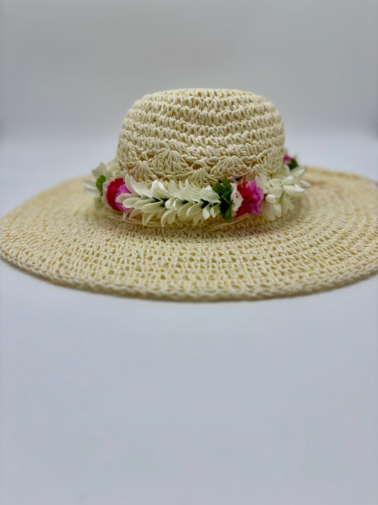 Tuberose Forever Lei Po‘o gracefully draped over a straw sun hat